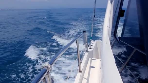 Boating in blue sea on sport fisher boat side view from bow in mediterranean — Stock Video