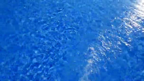 Blue tiles pool water reflection ripple as a summer vacation wavy surface — Stock Video