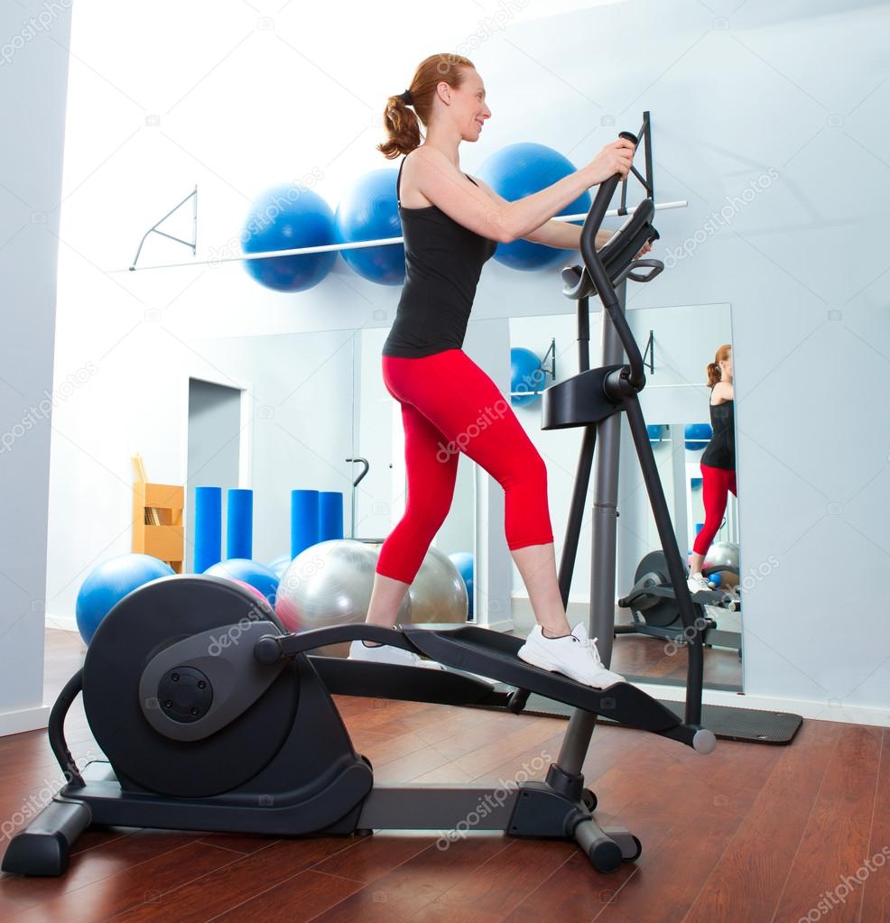 Aerobics cardio training woman on elliptic crosstrainer