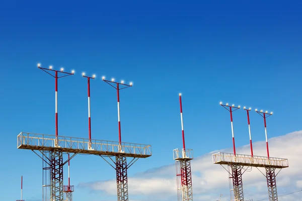 Landing lights towers in white and red — Stock Photo, Image