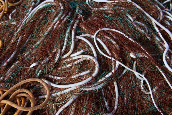 Fishing nets pattern mess stacked at port — Stock Photo, Image