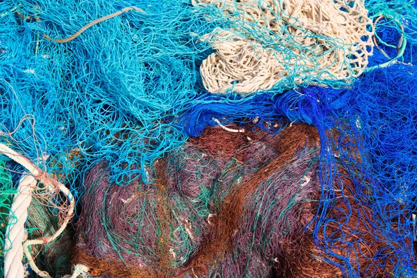 Fishing nets pattern mess stacked at port — Stock Photo, Image