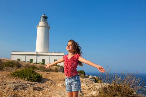 Blue day with kid girl open hands to the wind — стоковое фото