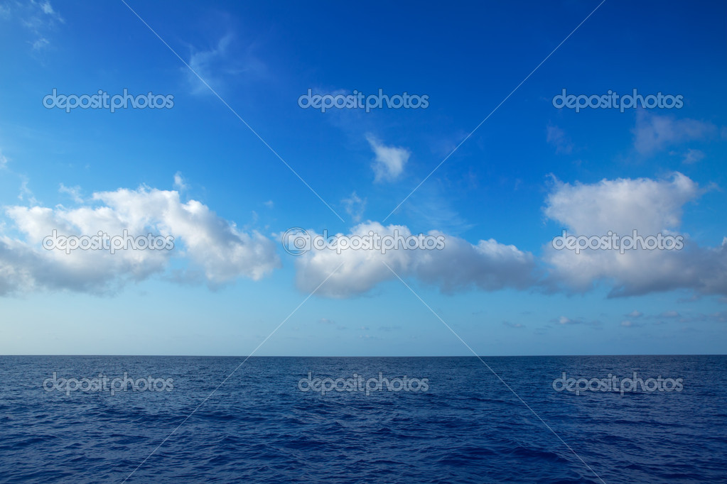Cumulus Clouds In Blue Sky Over Water Horizon Stock Photo Image By C Lunamarina