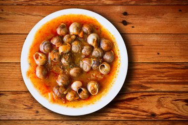 dish of snails prepared at spanish style clipart