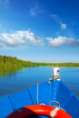 Blue boat sailing in Albufera lake of Valencia