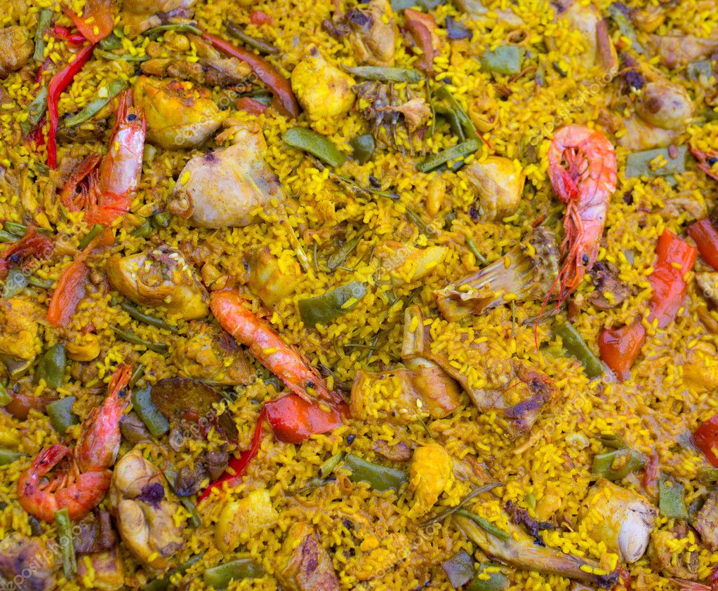 Spanish rice paella mixed of meat and seafood — Stock Photo