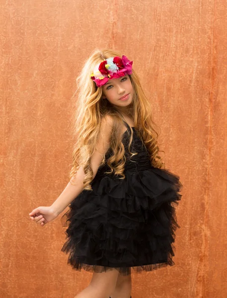 Black dress kid girl dancing on vintage background — Stock Photo, Image