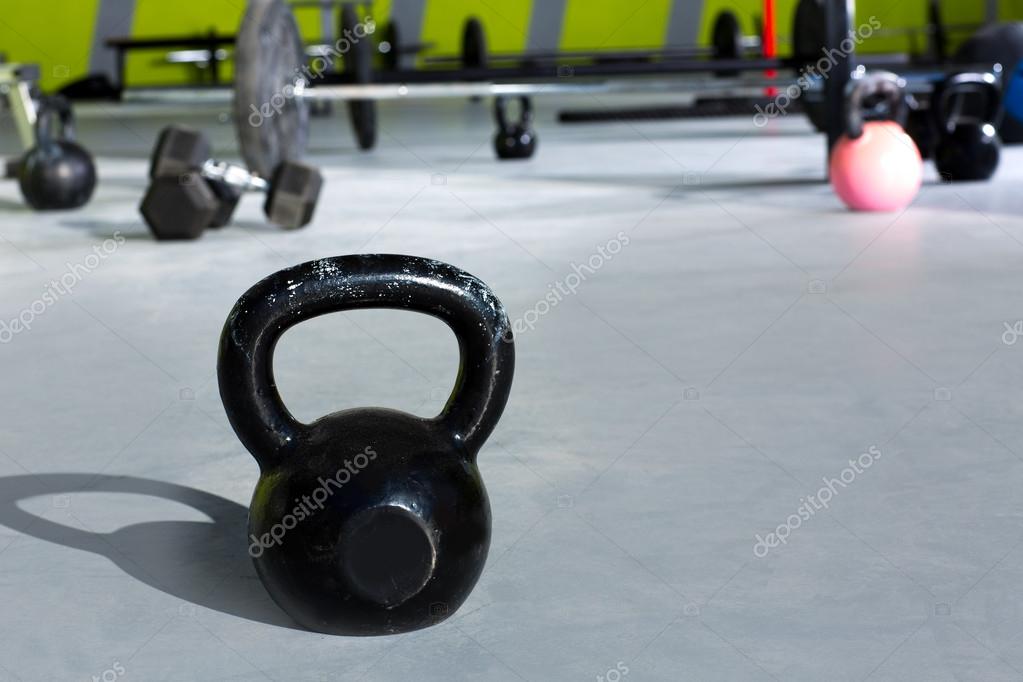 Kettlebell at crossfit gym with lifting bars Stock Photo by ©lunamarina ...