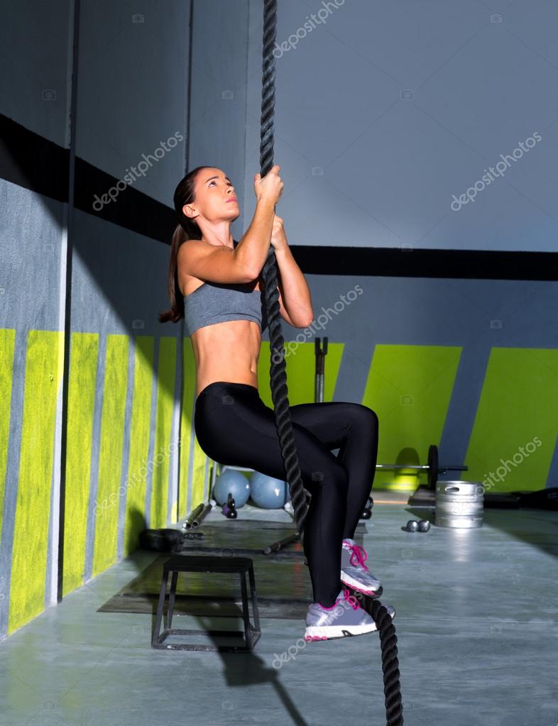 Crossfit rope climb exercise in fitness gym — Stock Photo © lunamarina  #18029137