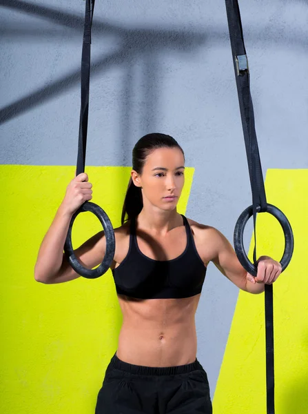 Crossfit dip ring woman relaxed after workout at gym — Stock Photo, Image