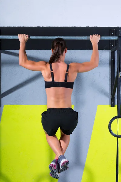 Crossfit toes to bar woman pull-ups 2 bars workout — Stock Photo, Image