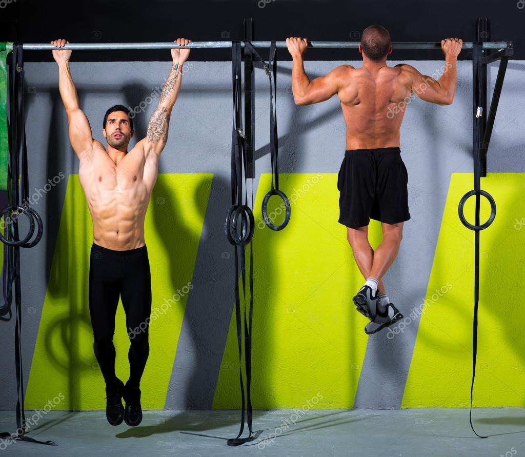 Crossfit toes to bar men pullups 2 bars workout — Stock Photo