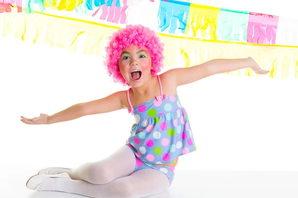 Child kid girl with party clown pink wig funny expression — Stock Photo, Image