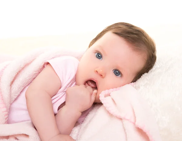 Baby girl with toothache in pink with white fur — Stock Photo, Image