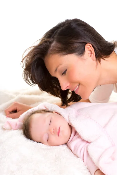 Baby girl sleeping with mother care near Stock Photo