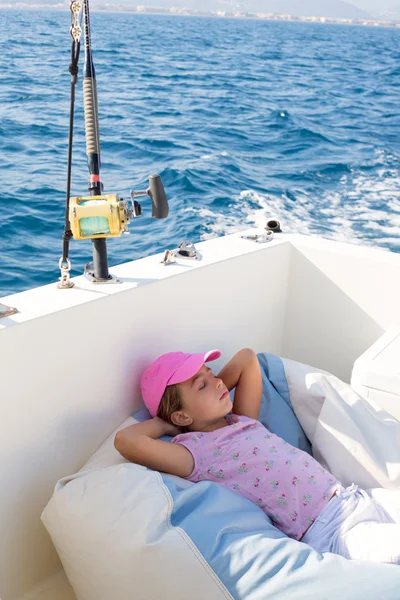 Child girl sailing relaxed on boat deck ejoying a nap — Stock Photo, Image