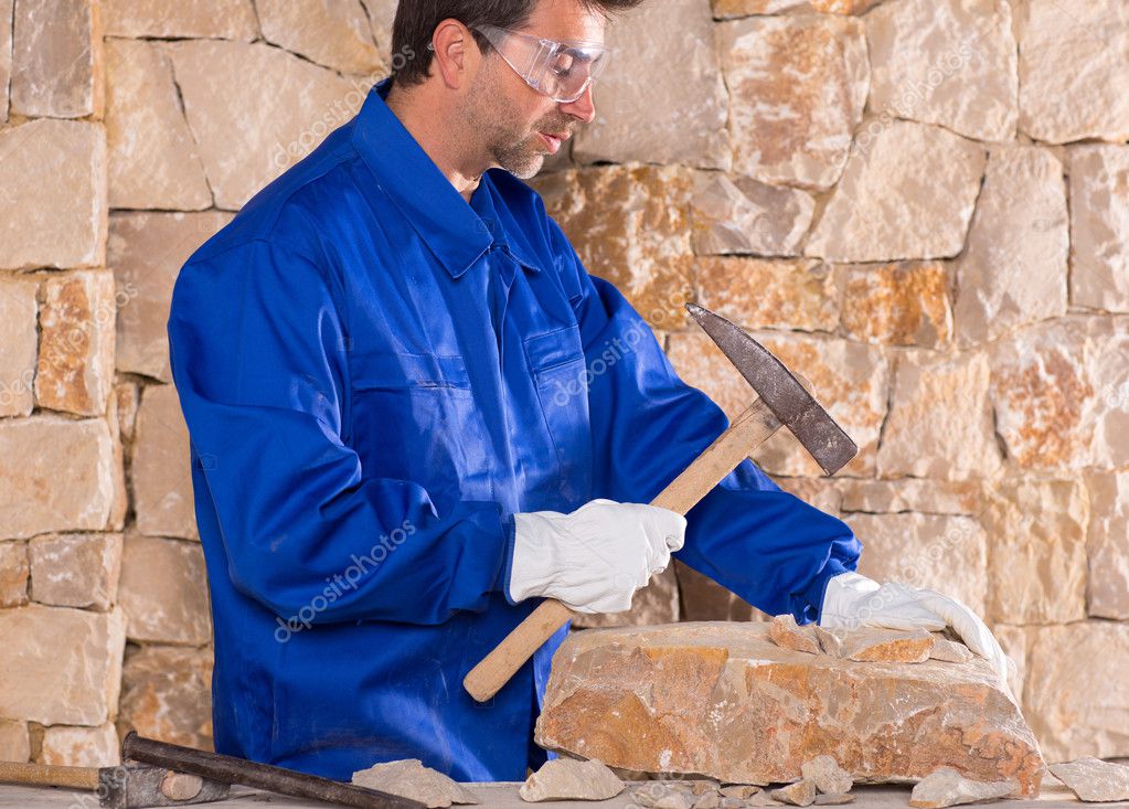 Masonry mason stonecutter man with hammer working Stock Photo by ©lunamarina 19539089