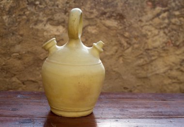 Botijo traditional clay pot jug to keep fresh water clipart
