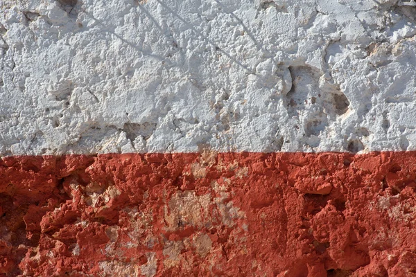 Aged whitewashed wall with red grunge paint — Stock Photo, Image