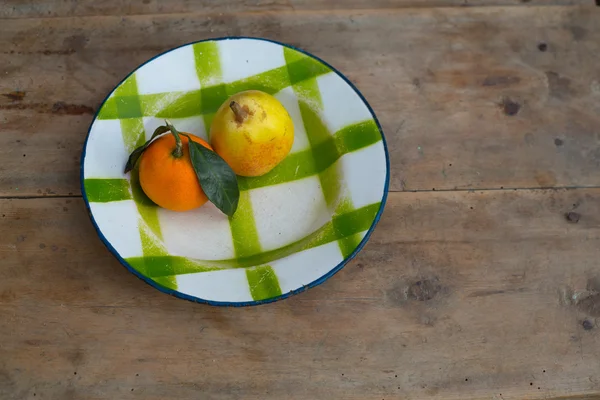 fruits tangerine and pear in vintage porcelain dish plate retro