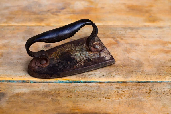 Aged vintage clothes iron in rusted metal — Stock Photo, Image