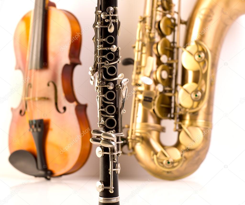 Sax tenor saxophone violin and clarinet in white