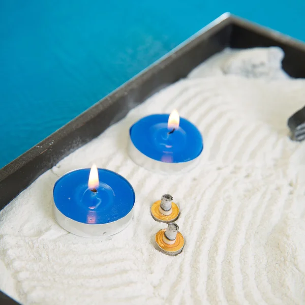 Zen little garden with blue candles and moxa — Stock Photo, Image