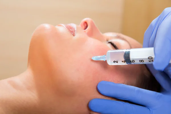 Anti aging facial mesotherapy syringe on woman face — Stock Photo, Image