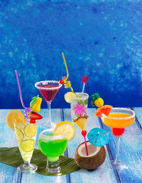 Colorful varied tropical Cocktails in tropical blue wood — Stock Photo, Image