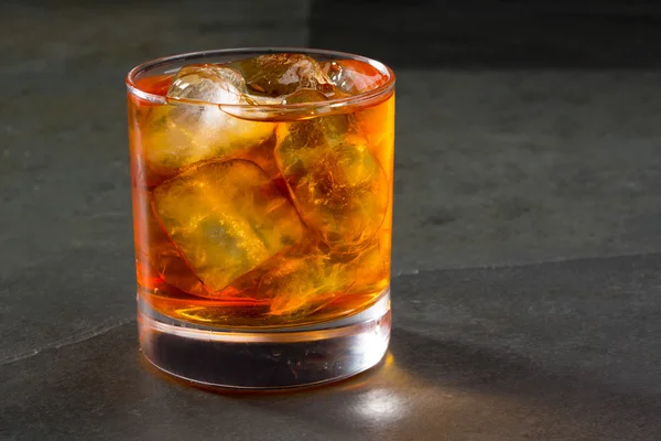 Whiskey whisky on the rocks on glass — Stock Photo, Image