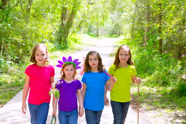 Friends and sister girls walking outdoor in forest track — Stock Photo, Image