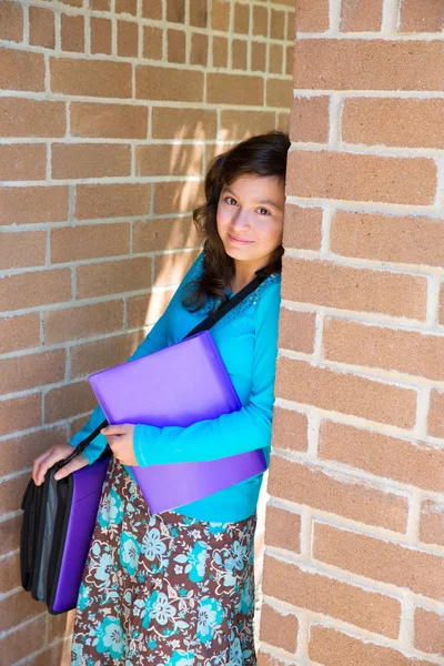 Schoolgirl teenager at school brick wall happy — Stock Photo, Image