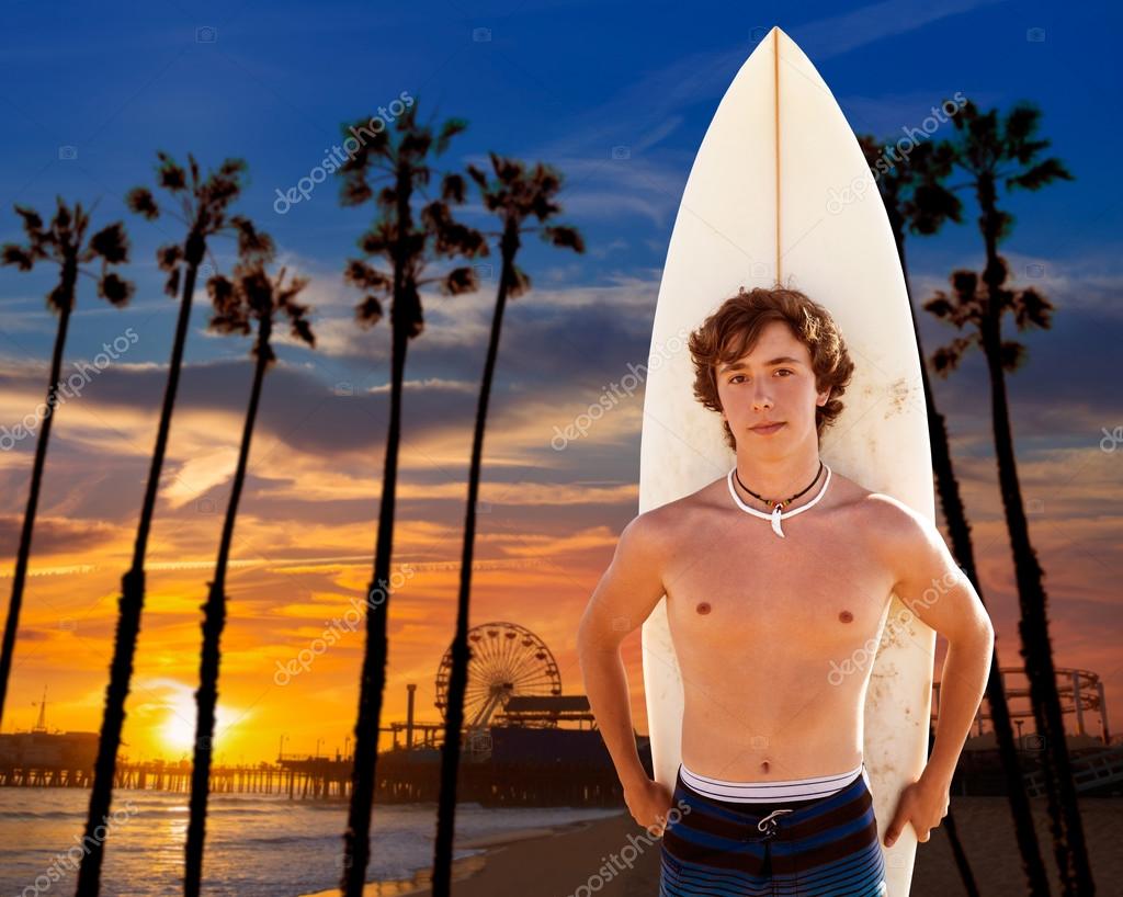 Surfer boy teenager with surfboard in Santa Monica Stock Photo by ...