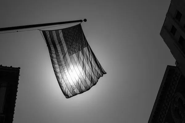 US american symbol flag over Black and white city — Stock Photo, Image