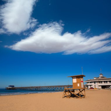 Newport pier beach with lifeguard tower in California clipart