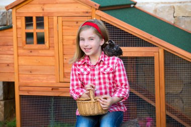 breeder hens kid girl rancher farmer with chicks in chicken coop clipart