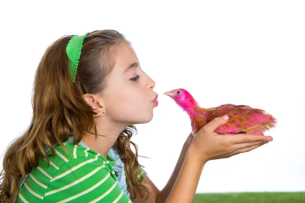 Breeder hens kid girl rancher farmer kissing a chicken chick — Stock Photo, Image
