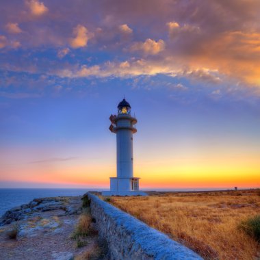 Formentera sunset in Barbaria cape lighthouse clipart