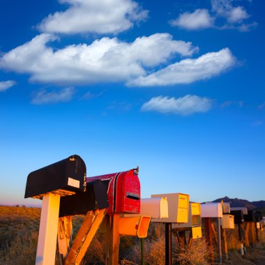 Grunge mail boxes in a row at Arizona desert clipart