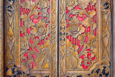 Indian inspired carved golden red wooden door clipart