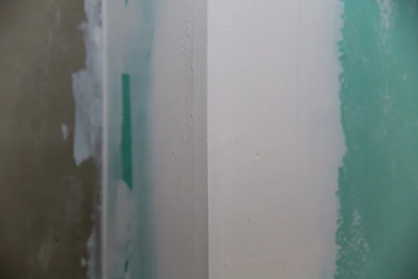 Drywall hydrophobic plasterboard in green plaster seam — Stock Photo, Image