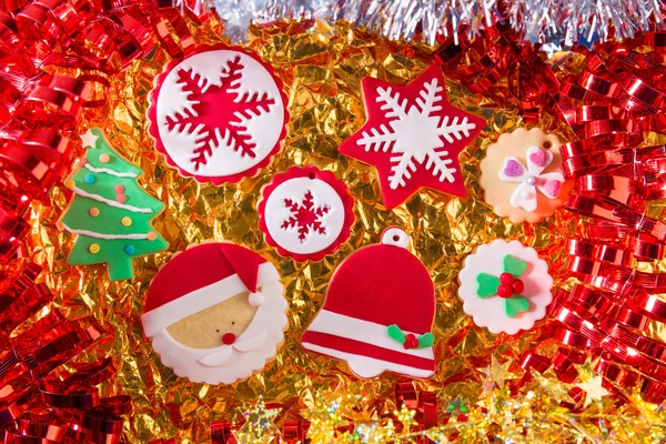 Christmas cookies Xmas tree Santa snowflake on golden — Stock Photo, Image