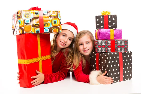 Christmas Santa kid girls with many gifts stacked — Stock Photo, Image
