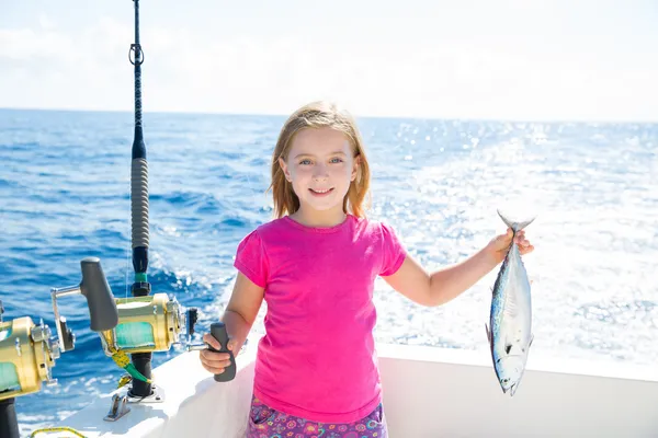 Blond kid girl fishing tuna little tunny happy with catch — Stock Photo, Image