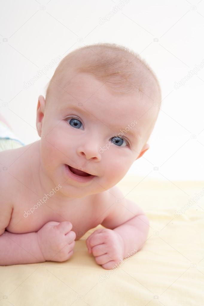 Bond little baby blue eyes lying down smiling