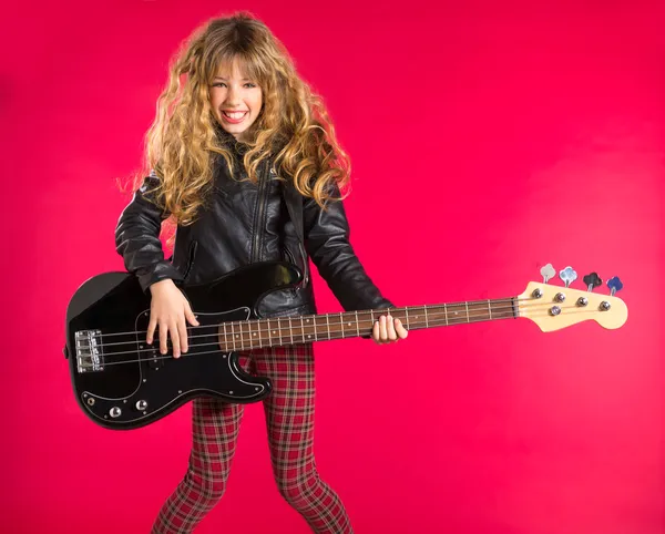 Blond Rock and roll girl with bass guitar on red — Stock Photo, Image