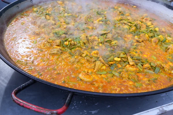 Cooking paella typical from Valencia Spain recipe with rice — Stock Photo, Image