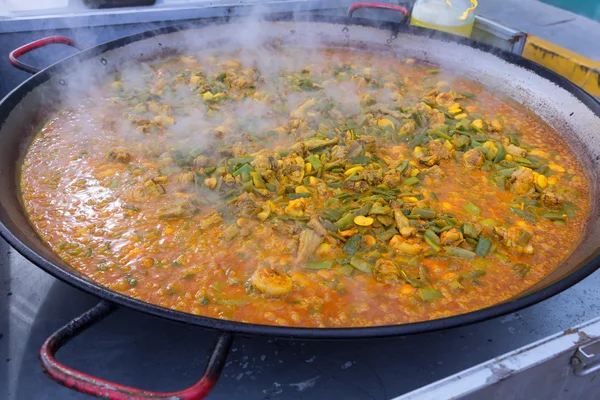 Cooking paella typical from Valencia Spain recipe with rice — Stock Photo, Image