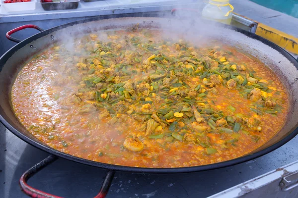 Cooking paella typical from Valencia Spain recipe with rice — Stock Photo, Image